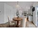 Kitchen features a round dining table and gray cabinets at 129 Eden Ave, Mooresville, NC 28115