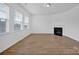 Bright living room with hardwood floors and a corner fireplace at 129 Eden Ave, Mooresville, NC 28115