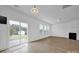 Bright living room with sliding glass door leading to backyard at 129 Eden Ave, Mooresville, NC 28115