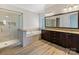 Luxurious bathroom featuring a glass shower, soaking tub, and granite countertops at 2257 Tatton Hall Rd, Fort Mill, SC 29715