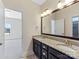 Bathroom featuring double sink vanity with granite countertop and framed mirror at 2257 Tatton Hall Rd, Fort Mill, SC 29715