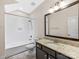 Bathroom featuring a shower-tub combo with white tile surround and granite vanity at 2257 Tatton Hall Rd, Fort Mill, SC 29715