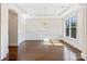 Formal dining area with hardwood floors, wainscoting, tray ceiling, and elegant chandelier at 2257 Tatton Hall Rd, Fort Mill, SC 29715