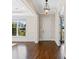 Spacious entryway with hardwood floors, detailed trim, and a charming pendant light at 2257 Tatton Hall Rd, Fort Mill, SC 29715