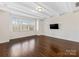 Bright living room with hardwood floors, recessed lighting, and large windows showcasing natural light at 2257 Tatton Hall Rd, Fort Mill, SC 29715