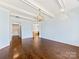 Spacious living room featuring hardwood flooring and stylish chandelier at 2257 Tatton Hall Rd, Fort Mill, SC 29715