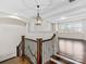 Staircase with dark hardwood railing and views of the living room at 2257 Tatton Hall Rd, Fort Mill, SC 29715