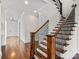 Elegant staircase showcasing wood steps and decorative metal railing at 2257 Tatton Hall Rd, Fort Mill, SC 29715