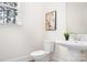 Powder room with pedestal sink and toilet at 328 Shinnville Rd, Mooresville, NC 28115