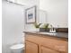 Modern bathroom with wood cabinets and tub at 328 Shinnville Rd, Mooresville, NC 28115