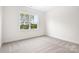 Simple bedroom with window and carpet at 328 Shinnville Rd, Mooresville, NC 28115