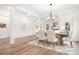 Formal dining room with chandelier and hardwood floors at 328 Shinnville Rd, Mooresville, NC 28115