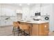 Kitchen island with white cabinets and quartz countertops at 328 Shinnville Rd, Mooresville, NC 28115