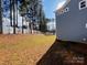 A view of the backyard featuring a large green space, fence and side of the house at 332 Shinnville Rd, Mooresville, NC 28115