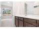 Bathroom with dark brown cabinets and view of a bedroom at 332 Shinnville Rd, Mooresville, NC 28115