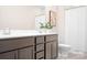 Bathroom featuring double sink vanity with modern fixtures, and toilet with shower behind at 332 Shinnville Rd, Mooresville, NC 28115