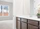 Bathroom view, featuring a modern vanity with a white countertop and view into adjacent bedroom at 332 Shinnville Rd, Mooresville, NC 28115