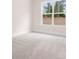 An empty bedroom with carpet and a window at 332 Shinnville Rd, Mooresville, NC 28115