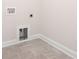 This laundry room features tile flooring and standard hookups for a washer and dryer at 332 Shinnville Rd, Mooresville, NC 28115