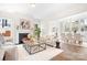 Bright living room with a fireplace, hardwood floors, and plenty of natural light at 332 Shinnville Rd, Mooresville, NC 28115