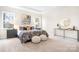 Main bedroom featuring large windows and plush carpet at 332 Shinnville Rd, Mooresville, NC 28115