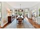 Spacious dining room with hardwood floors, stylish chandelier, and inviting atmosphere at 2110 E 5Th St, Charlotte, NC 28204