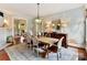 Elegant dining room with stylish lighting, neutral decor, and hardwood floors at 2110 E 5Th St, Charlotte, NC 28204