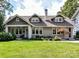 Charming craftsman-style home featuring a well-manicured lawn and welcoming front porch at 2110 E 5Th St, Charlotte, NC 28204