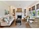 Bright living room featuring a fireplace, built-in bookshelves, and comfortable seating at 2110 E 5Th St, Charlotte, NC 28204