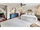 Bright main bedroom with a dark blue dresser, white carpet, and natural light, creating an inviting space at 2110 E 5Th St, Charlotte, NC 28204