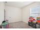 Bedroom with window and gray carpet filled with boxes at 4233 Poplin Grove Dr, Indian Trail, NC 28079