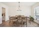 Elegant dining room showcases hardwood floors, large table, and natural light at 4233 Poplin Grove Dr, Indian Trail, NC 28079