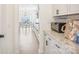 This is a kitchen with granite countertops, subway tile backsplash, and a view into the dining room area at 4233 Poplin Grove Dr, Indian Trail, NC 28079