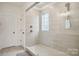 Shower featuring glass enclosure, window, and chrome water fixture at 4233 Poplin Grove Dr, Indian Trail, NC 28079