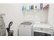 Bright laundry room with modern appliances, convenient shelving, and cleaning supplies at 4233 Poplin Grove Dr, Indian Trail, NC 28079