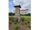 Westport community sign made of brick and stone sitting in a landscaped area with trees in the background at 303 Miramar Dr, York, SC 29745