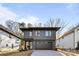 Modern two-story home with dark gray exterior and attached garage at 3623 Avalon Ave, Charlotte, NC 28208