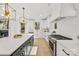 Modern kitchen with white cabinets, stainless steel appliances and a statement island at 3623 Avalon Ave, Charlotte, NC 28208