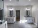 Elegant bathroom with double vanities, marble floors, and walk-in closet at 409 19Th Avenue Nw Cir # 12, Hickory, NC 28601