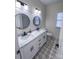 Bathroom with double vanity, patterned floor, and updated fixtures at 409 19Th Avenue Nw Cir # 12, Hickory, NC 28601