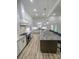 Eat-in kitchen with granite island, stainless steel appliances, and white cabinets at 409 19Th Avenue Nw Cir # 12, Hickory, NC 28601