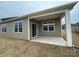 Covered back patio with concrete flooring, providing an outdoor space for relaxation at 225 Brinkley Rd # 99, Kings Mountain, NC 28086