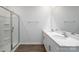 Bathroom with double vanity, shower, and wood-look floors at 225 Brinkley Rd # 99, Kings Mountain, NC 28086