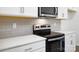 Modern kitchen with white cabinets, quartz countertops and stainless steel appliances at 225 Brinkley Rd # 99, Kings Mountain, NC 28086