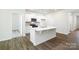 Modern kitchen with white cabinetry, quartz countertops, and an island at 225 Brinkley Rd # 99, Kings Mountain, NC 28086