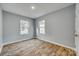 This bedroom offers wood-look floors and good natural light from its two windows at 337 Friendship Dr, Rock Hill, SC 29730