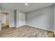 Spacious bedroom featuring wood-look flooring and a double door closet for ample storage at 337 Friendship Dr, Rock Hill, SC 29730