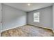 Bright and airy bedroom with wood-look flooring and a large window offering ample natural light at 337 Friendship Dr, Rock Hill, SC 29730