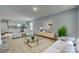 Bright, open-concept living room with a view of the modern kitchen and dining area at 337 Friendship Dr, Rock Hill, SC 29730