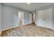 Main bedroom featuring wood-look flooring, ensuite bathroom, and a closet for ample storage at 337 Friendship Dr, Rock Hill, SC 29730